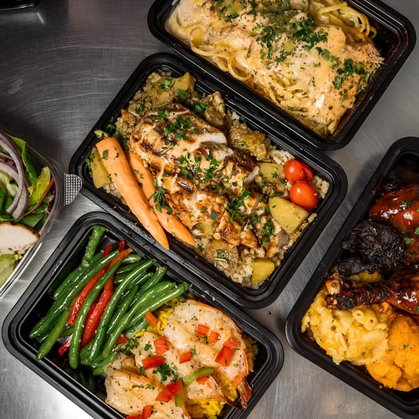 Victoria's Kitchen & Catering soul food meals, including pasta, chicken, shrimp, green beans, and mac and cheese.